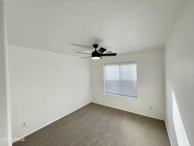 unfurnished room featuring carpet flooring and ceiling fan