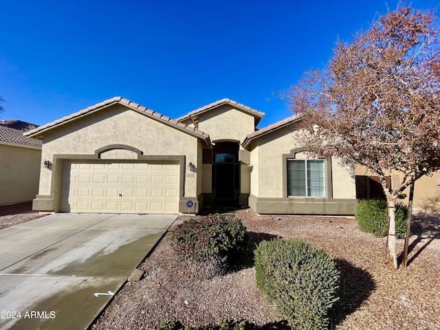 view of front of property with a garage