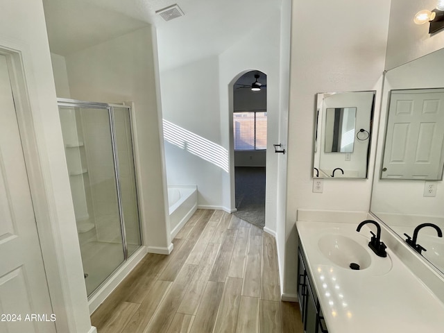 bathroom featuring hardwood / wood-style flooring, ceiling fan, independent shower and bath, and vanity