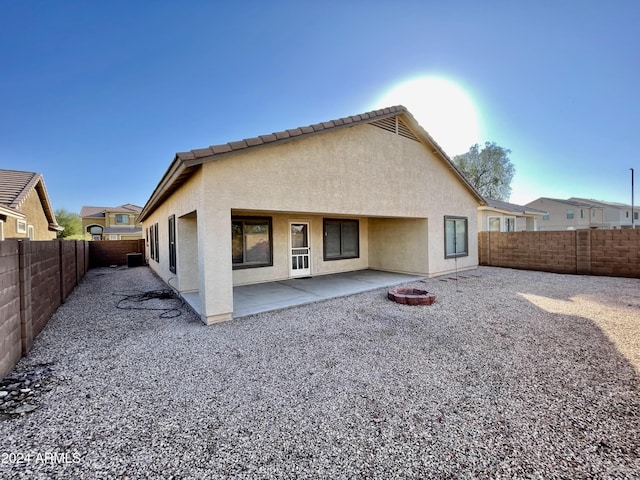 rear view of house with a patio