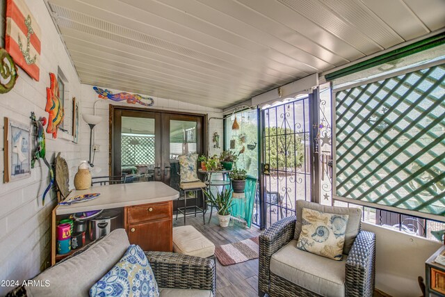 sunroom featuring french doors