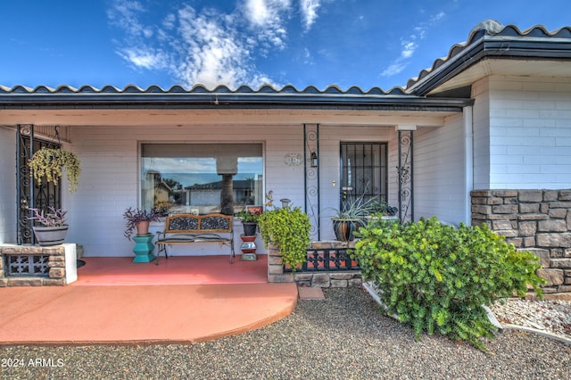 entrance to property with a porch