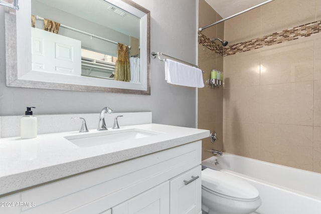 full bathroom with toilet, vanity, and shower / tub combo with curtain