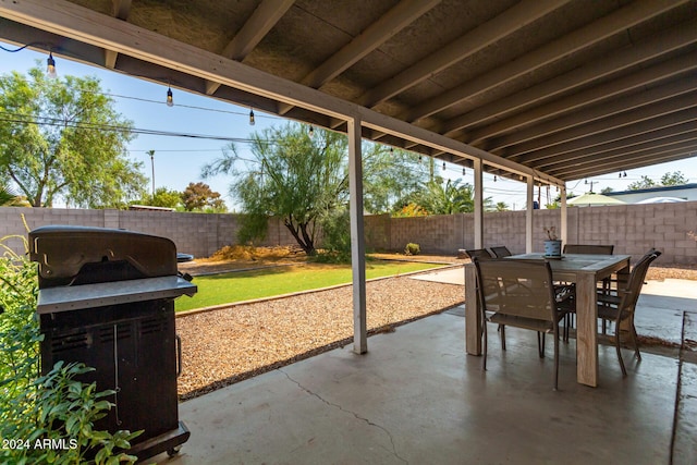 view of patio with a grill