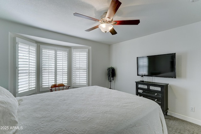 bedroom with baseboards, carpet floors, and ceiling fan