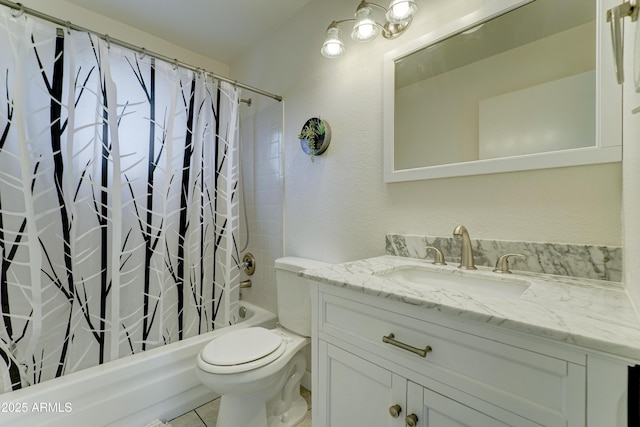 bathroom with toilet, shower / bath combo, and vanity