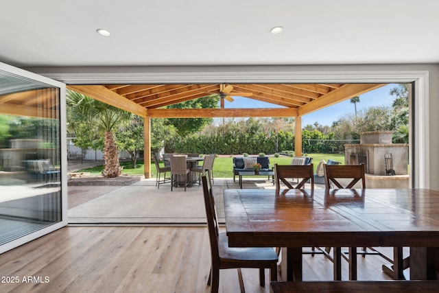 interior space featuring wood finished floors and lofted ceiling