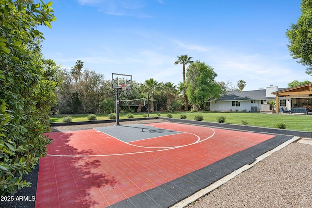 view of sport court with a yard and basketball court