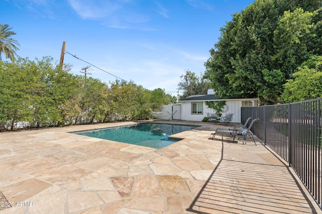 view of pool featuring a fenced in pool, fence, and a patio area