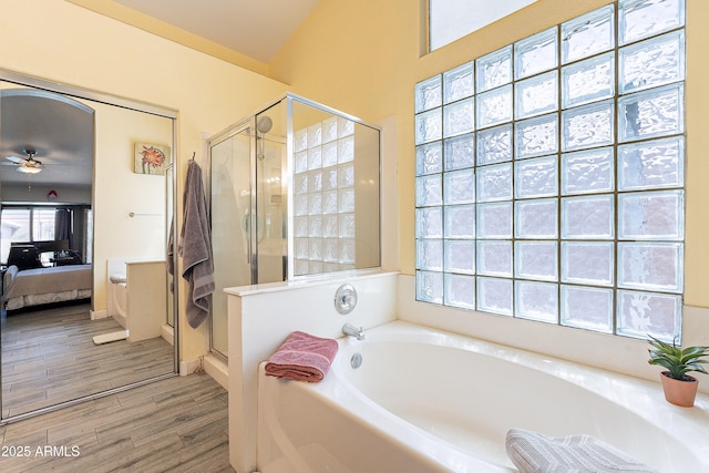 8510 W Joan De Arc Ave, Peoria, AZ 85381 - ensuite bathroom featuring a stall shower, wood finished floors, ceiling fan, a garden tub, and connected bathroom