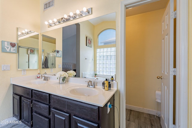 8510 W Joan De Arc Ave, Peoria, AZ 85381 - full bathroom featuring wood finished floors, a sink, visible vents, and double vanity