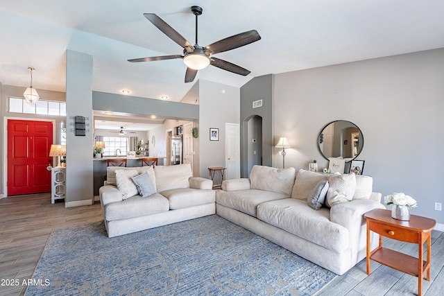 8510 W Joan De Arc Ave, Peoria, AZ 85381 - living area with baseboards, wood finished floors, arched walkways, and ceiling fan