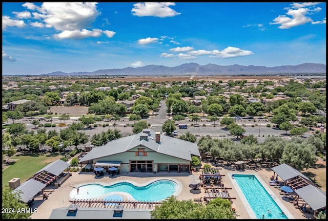 birds eye view of property with a mountain view