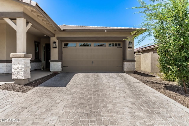 view of front of property featuring a garage