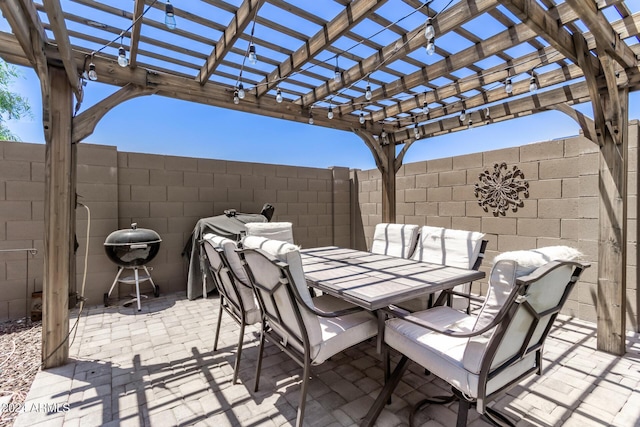 view of patio with a pergola and grilling area