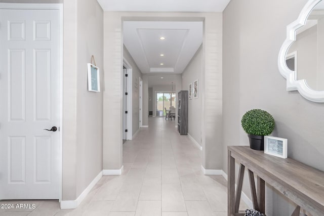 hallway featuring light tile patterned flooring