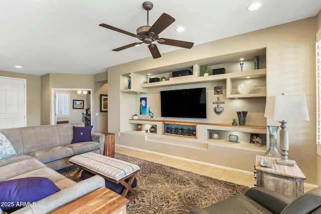 living area with tile patterned flooring, recessed lighting, built in shelves, and a ceiling fan