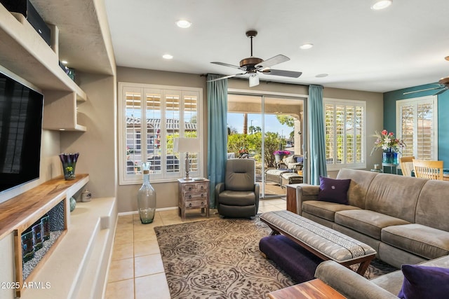 living room featuring light tile patterned flooring, recessed lighting, baseboards, and ceiling fan