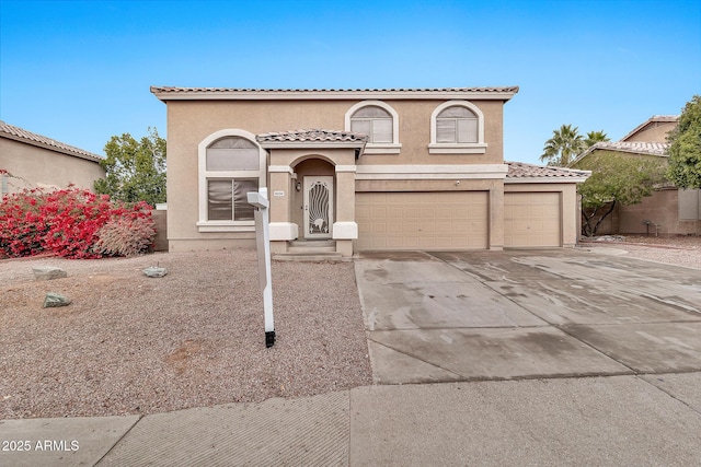 mediterranean / spanish-style house featuring a garage