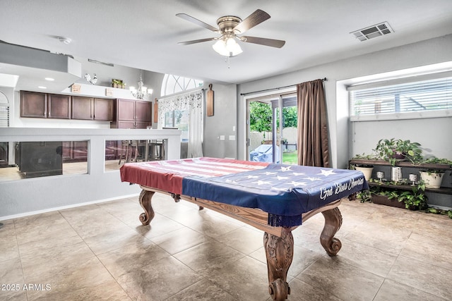 playroom with pool table and ceiling fan with notable chandelier