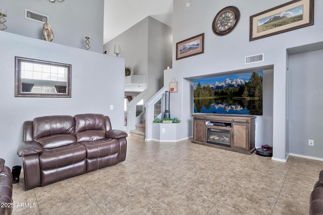 living room with a high ceiling