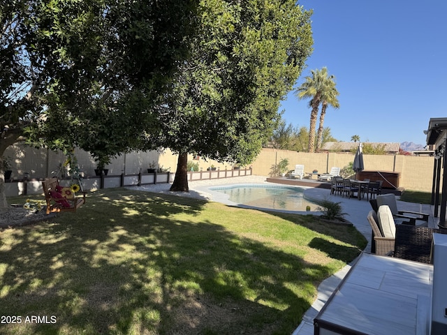 view of yard featuring a fenced in pool and a patio