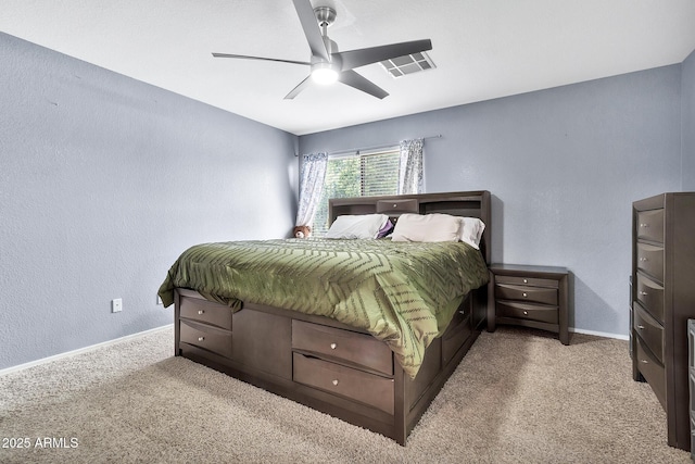 bedroom featuring light colored carpet and ceiling fan