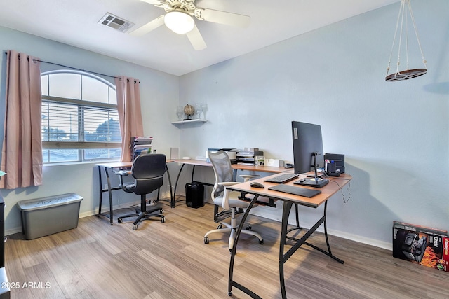 office featuring hardwood / wood-style flooring and ceiling fan