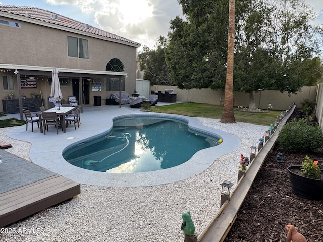 view of swimming pool featuring a patio