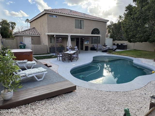 view of swimming pool with an outdoor living space, a patio area, and a hot tub