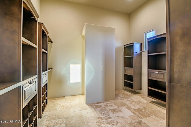 36430 N 34th Ave, Phoenix, AZ 85086 - walk in closet featuring stone tile flooring
