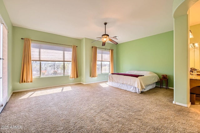 unfurnished bedroom featuring visible vents, carpet, baseboards, and ceiling fan