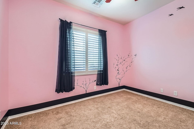 unfurnished room with a ceiling fan, baseboards, visible vents, and carpet floors