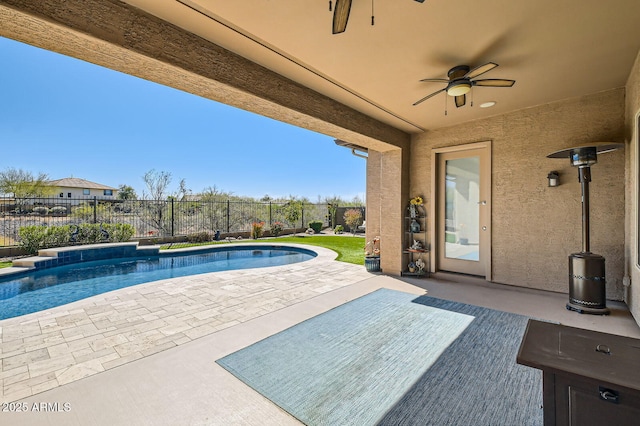 view of pool with a ceiling fan, a patio area, a fenced in pool, and a fenced backyard