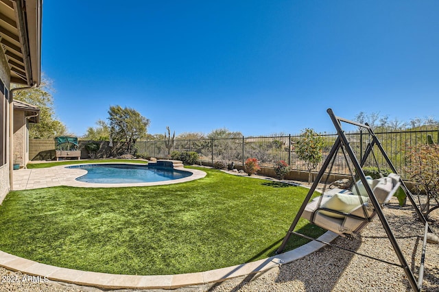 view of yard featuring a patio area, a fenced in pool, and a fenced backyard