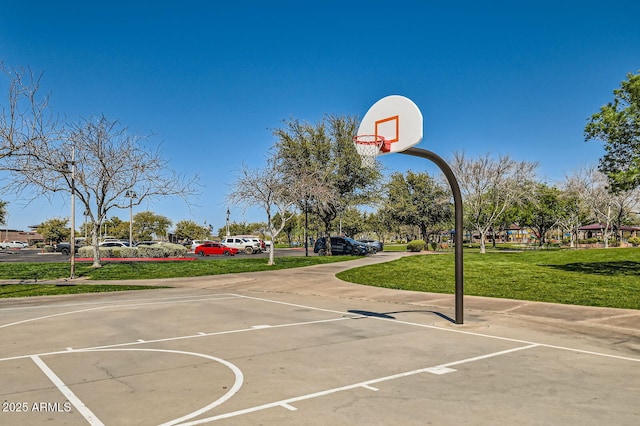 view of basketball court featuring community basketball court and a lawn