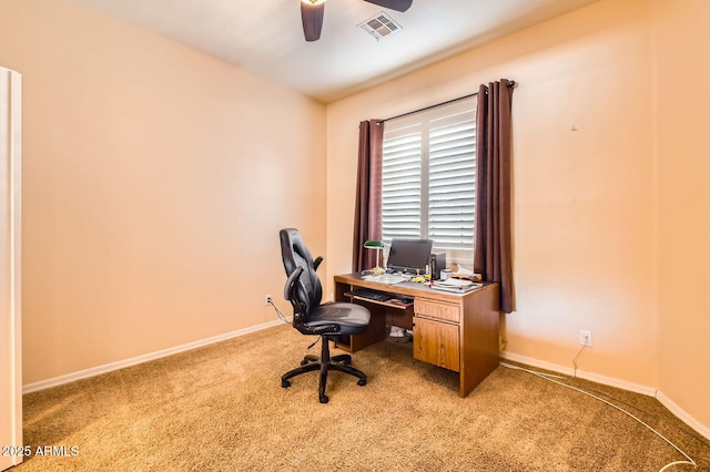 home office featuring visible vents, light carpet, baseboards, and ceiling fan