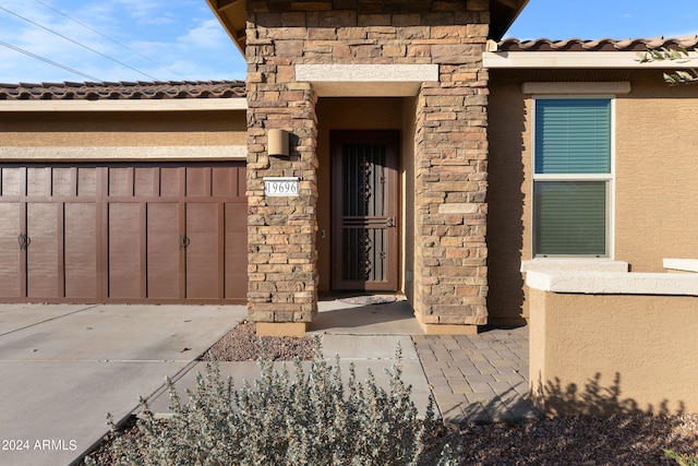 property entrance with a garage