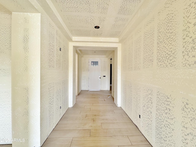 hallway with wood finish floors