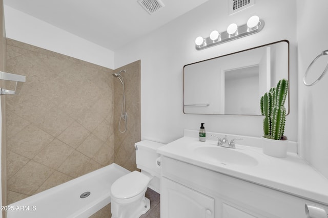2812 E Clarendon Ave, Phoenix, AZ 85016 - bathroom featuring vanity, toilet, and a tile shower