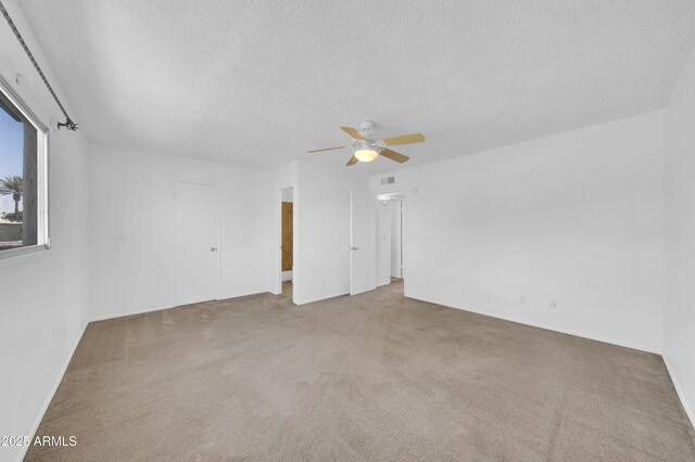 2812 E Clarendon Ave, Phoenix, AZ 85016 - carpeted spare room featuring a textured ceiling, a ceiling fan, and baseboards