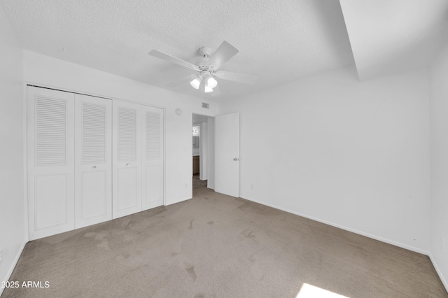 2812 E Clarendon Ave, Phoenix, AZ 85016 - unfurnished bedroom featuring carpet flooring, a closet, a textured ceiling, baseboards, and ceiling fan