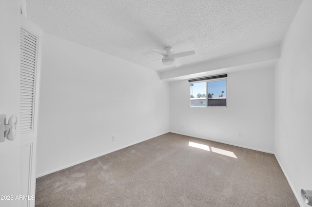 2812 E Clarendon Ave, Phoenix, AZ 85016 - empty room featuring carpet, a textured ceiling, a ceiling fan, and baseboards