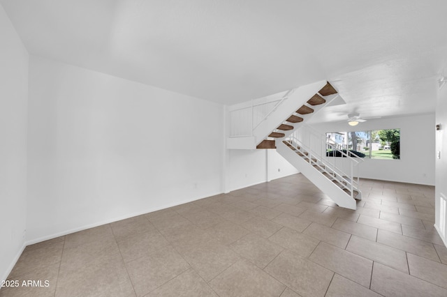 2812 E Clarendon Ave, Phoenix, AZ 85016 - tiled spare room featuring stairs and ceiling fan