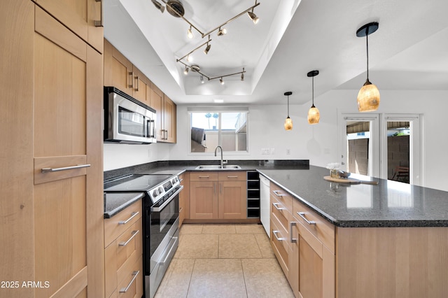2812 E Clarendon Ave, Phoenix, AZ 85016 - kitchen with appliances with stainless steel finishes, a sink, a peninsula, a tray ceiling, and dark stone countertops