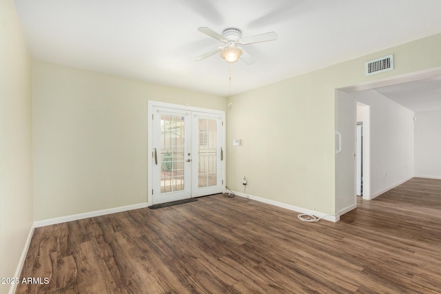 unfurnished room with ceiling fan, visible vents, french doors, and wood finished floors