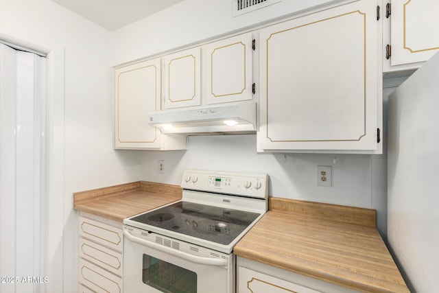 kitchen featuring under cabinet range hood, light countertops, visible vents, and white appliances