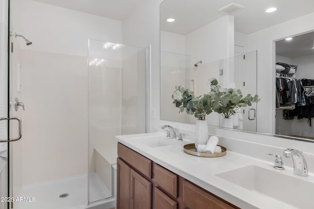 bathroom with vanity and walk in shower