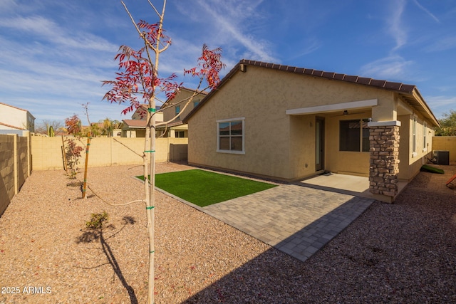 back of house featuring a patio and central air condition unit