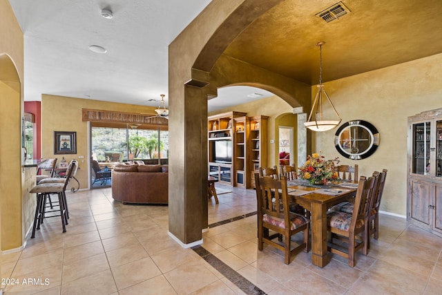 dining room featuring light tile patterned flooring